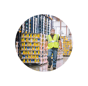 Man in warehouse in a white circle gear.