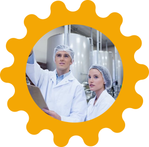 Man and woman in white lab coats inside a yellow gear